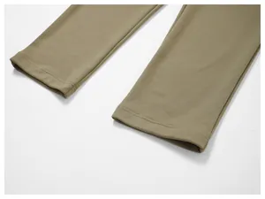 Close-up detail of double-stitched leg cuffs on khaki men's casual sweatpants.