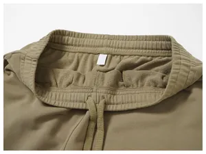 Detail of men's casual joggers waistband with elastic waist and drawstring