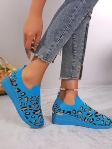Detail view of blue leopard print flyknit wedge sneakers for women's casual wear