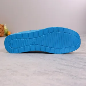 Detail view of the durable blue textured sole of women's casual sports shoes