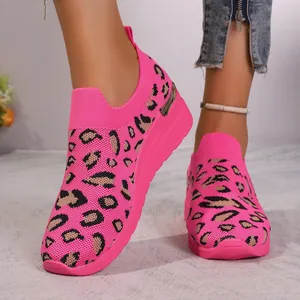 Detail of pink leopard print fly-knit platform sneakers with metallic heel accent