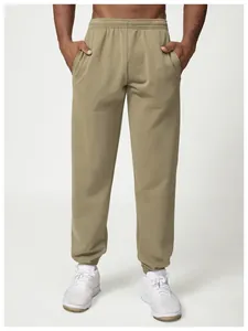 Full front view of men's olive khaki jogger pants with elastic waist and side pockets