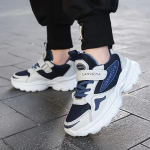 Breathable children's athletic sneakers in navy and white mesh design for outdoor activities.