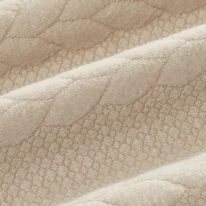 Makroaufnahme des schweren Jacquard-Strickgewebes mit kompliziertem Strukturmuster