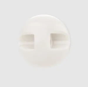 Detailed view of a high-end white glossy ceramic button with a minimalist round design.
