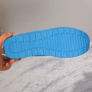 Close-up of the durable blue rubber outsole for women's flyknit mesh casual shoes