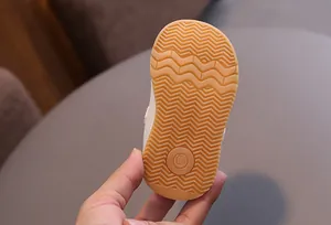 Close-up of anti-slip gum rubber sole on toddler walking shoe showing size 16