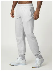 Detailed side view of men's light gray joggers featuring elasticated cuffs and waistband