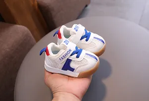 Breathable toddler walking shoes with blue mesh detailing and easy Velcro straps