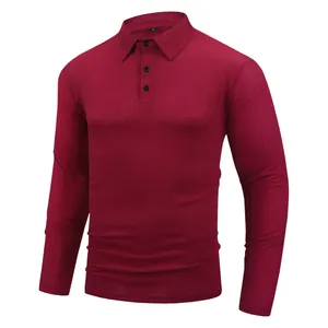 Close-up detail of burgundy men's long sleeve polo shirt with waffle jacquard texture