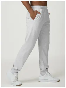 Detailed side view of men's grey heathered joggers showing fit and elastic hem