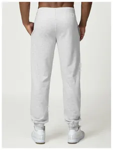 Rear view detail of men's light grey joggers with comfortable elastic cuffed ankles