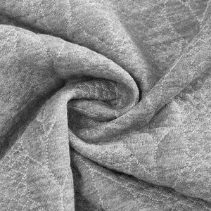 Detailansicht von grauem, schwerem Strickstoff mit einem Vintage-Jacquard-Muster