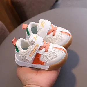Breathable mesh baby walking shoes in white and orange for toddlers and infants