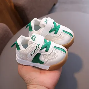 Breathable mesh toddler walking shoes with green accents and non-slip rubber soles.