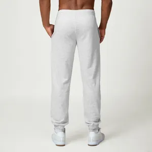 Mens minimalist grey joggers sweatpants for gym and casual wear back view studio shot