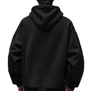 Detailed back view of a solid black oversized fleece hooded sweatshirt for men.