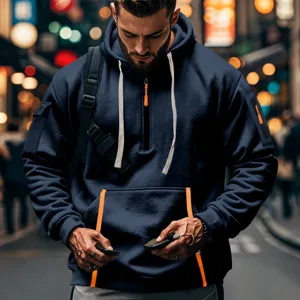 Detail of men's navy blue fleece hoodie featuring arm pocket and functional half-zip