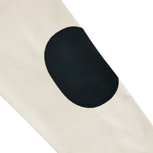 Detail view of contrast black elbow patch on heavyweight oatmeal sweatshirt sleeve