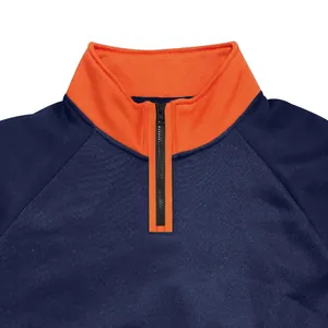 Close-up detail of navy and orange colorblock sweatshirt with half-zip stand collar