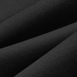 Close-up of premium black fleece sweatshirt fabric showing soft knit texture detail