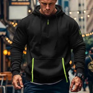 Close-up of a men's black fleece-lined hoodie featuring vibrant lime green accents.