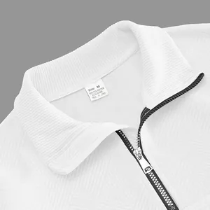Macro view of white jacquard sweatshirt collar with black half-zip and care label