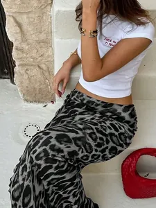 Fashionable leopard print slim fit maxi skirt shown in a stylish outdoor street setting