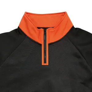 Close-up of half-zip stand-up collar on a black and orange color-block sweatshirt.