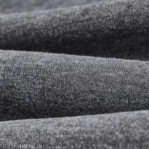 Close-up detail of soft dark gray knitted fabric for men's winter fleece hoodie