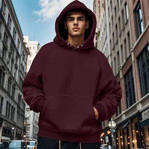 Detailed view of a dark maroon men oversized fleece hoodie in an urban street setting