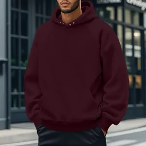 Close-up of men's burgundy fleece hoodie featuring snap collar and kangaroo pocket