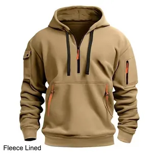 Detailed view of the khaki multi-pocket fleece-lined tactical hoodie with orange zipper pulls