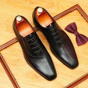 Clásicos zapatos Oxford de cuero genuino negro para hombre con elegante diseño de punta y cordones