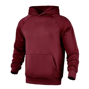 Detailed macro view of dark red men's fleece hoodie with raglan sleeves and pocket.
