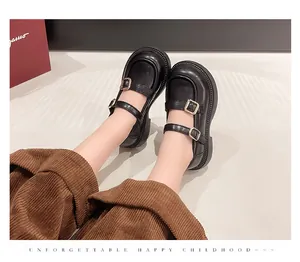 Detail view of classic black British style Mary Jane leather shoes for girls on feet