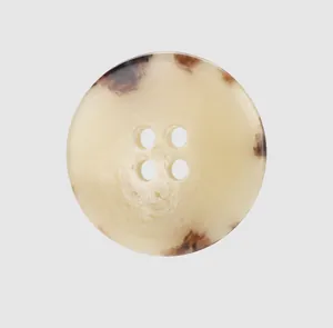 Detailed view of high-end round urea button with vintage tortoiseshell pattern