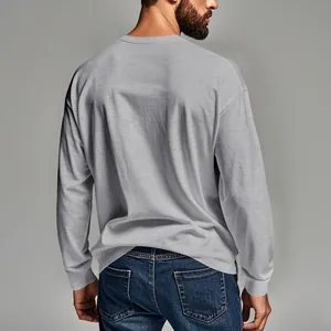 Back view of a comfortable men's light gray long-sleeve crew neck casual solid t-shirt.