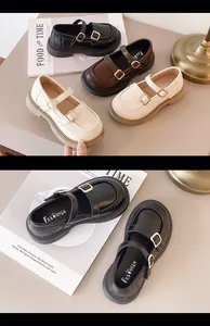 Detailed view of girls' British style Mary Jane shoes with double gold buckles.