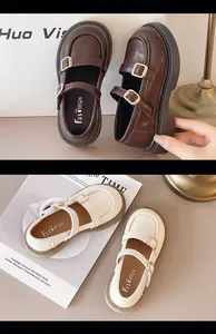 Close-up of classic British style Mary Jane shoes for girls in brown and cream colors