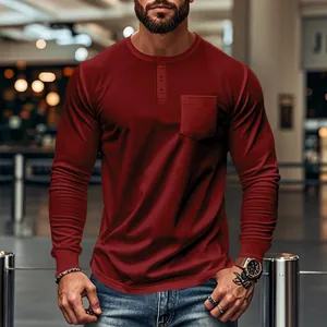 Close-up of men's slim fit burgundy long sleeve Henley shirt with chest pocket
