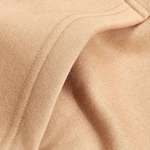 Macro view showing the soft khaki fleece fabric and precise stitching of a men's hoodie