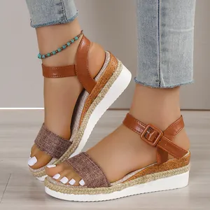 Women's stylish brown platform wedge sandals with adjustable ankle strap and woven rope sole detail