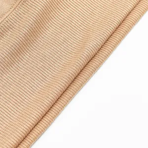 Macro close-up detail showing the texture of beige ribbed knit fabric for men's fleece hoodie