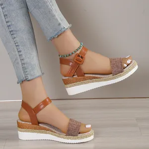 Stylish women's platform wedge sandals with brown buckle strap for summer beach wear.