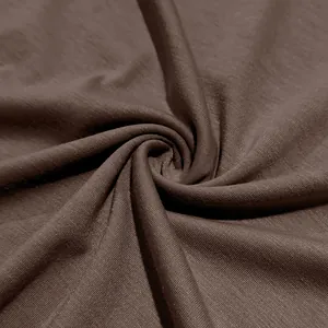 Macro shot of premium brown knit fabric texture for men's breathable slim fit T-shirt.