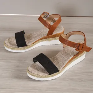 Women's stylish wedge sandals featuring a black fabric strap and brown buckle ankle strap