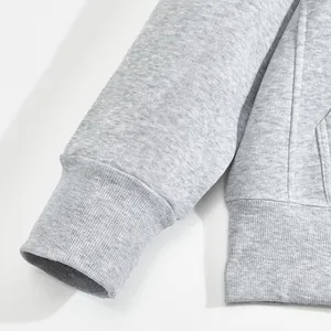 Detail showing ribbed cuffs and soft fleece texture on grey men's winter hoodie