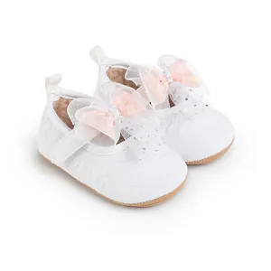 Adorable white baby pre-walker shoes featuring pink mesh bows and delicate floral pattern