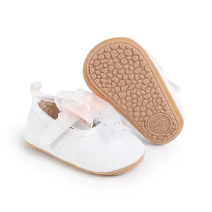 White baby walker shoes with delicate lace bow and anti-slip textured rubber sole